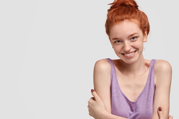 Free Photo Redhead Shy Woman With Freckled Skin Has Gentle Smile