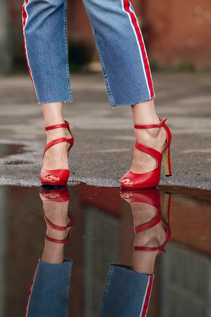 blue jeans with red shoes