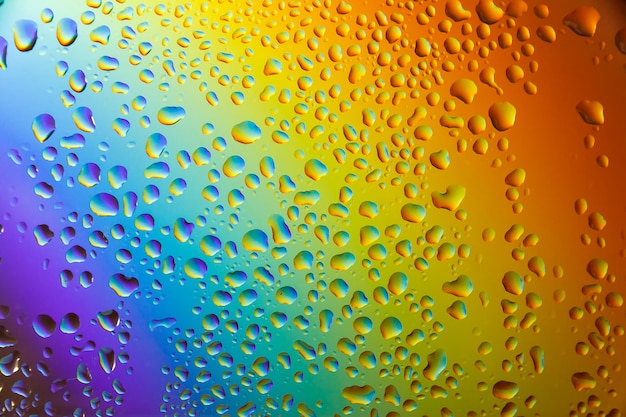 Premium Photo Reflection Of The Rainbow In The Raindrops On The Glass