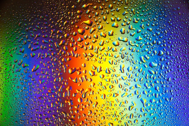 Premium Photo Reflection Of The Rainbow In The Raindrops On The Glass