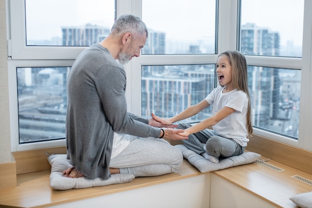 premium-photo-relaxation-calm-adult-gray-haired-dad-and-enthusiastic