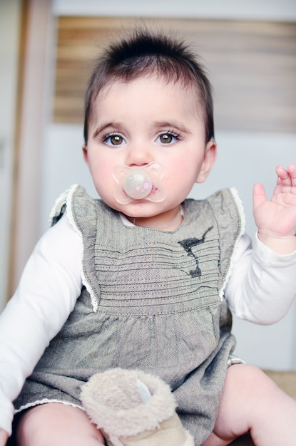 Free Photo Relaxed Baby With A Pacifier