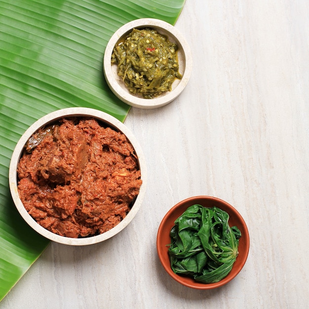 Premium Photo Rendang Balado Paru And Cassava Leaf Menu Nasi Padang