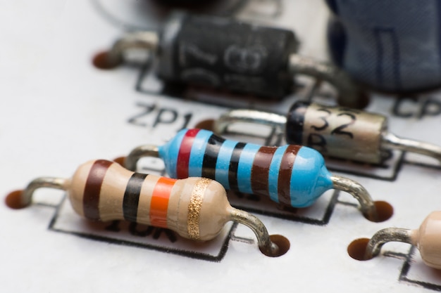 Premium Photo | Resistor, capacitor and diode on circuit board close up ...