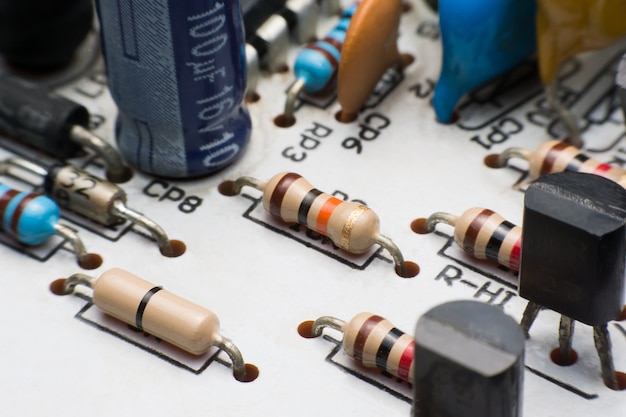 Premium Photo | Resistor, capacitor and transistor on circuit board