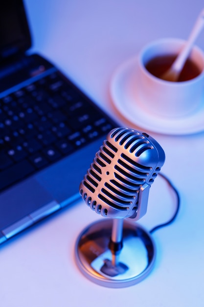 Retro microphone and notebook computer, live webcast on air concept Free Photo