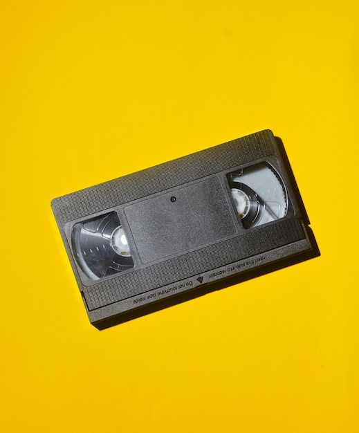 Premium Photo | Retro Videocassette From 80s On A Yellow Background ...