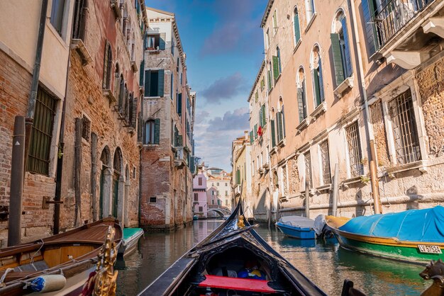 Premium Photo Riding A Traditional Gondola Down The Narrow Canals In