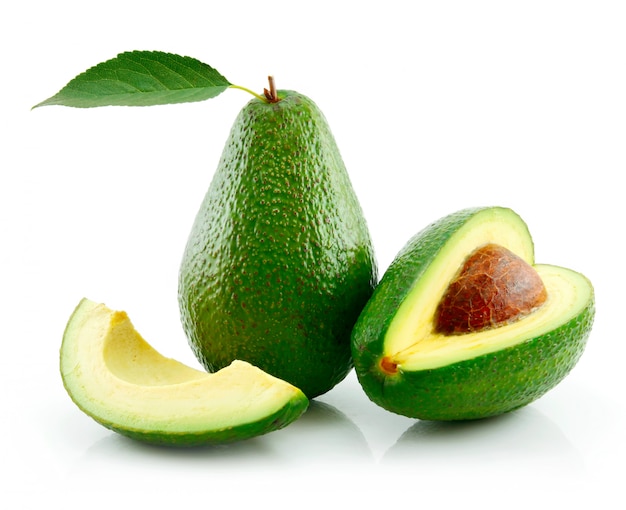 Ripe avocado with green leaf isolated on white Premium Photo