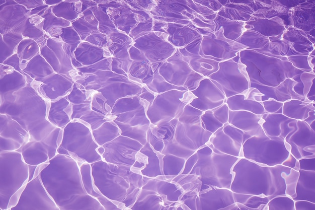 Premium Photo | Rippled pattern of clean water in a purple swimming ...
