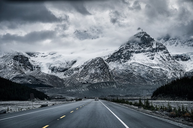 Premium Photo Road Trip With Snowy Rocky Mountains In Gloomy At Icefields Parkway Canada