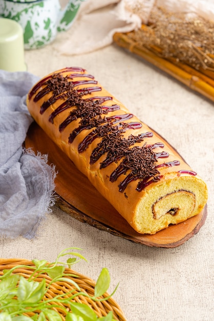 Premium Photo Roll Cake Is A Sponge Cake That Is Baked Using A Shallow Pan Filled With Jam Or