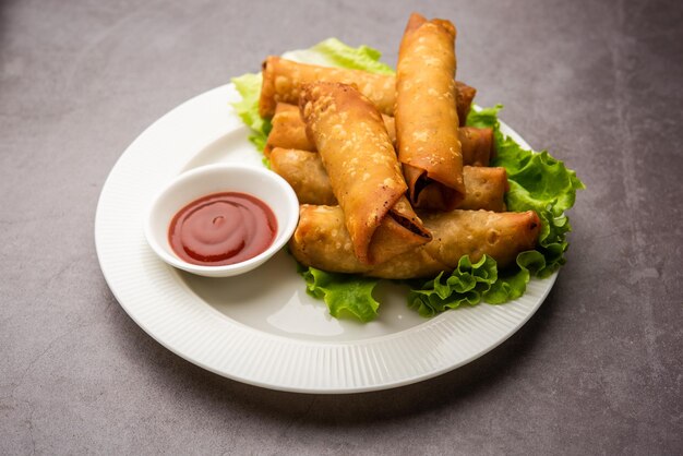 Premium Photo | Roll shaped cigar samosa are the perfect finger food ...