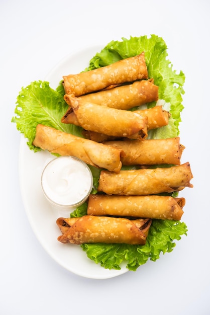 Premium Photo | Roll shaped cigar samosa are the perfect finger food ...