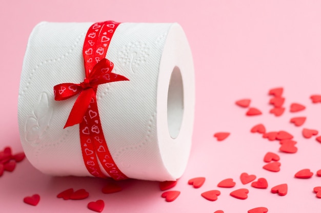 Premium Photo Roll Of Toilet Paper As Gift For Valentine S Day Next To Red Hearts On Pink