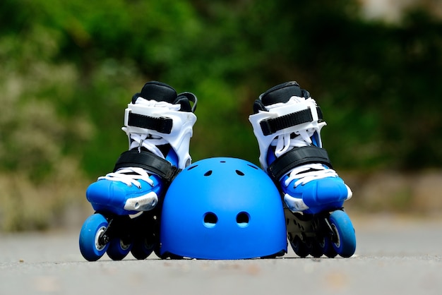 Premium Photo | Roller inline skates with helmet in skate park
