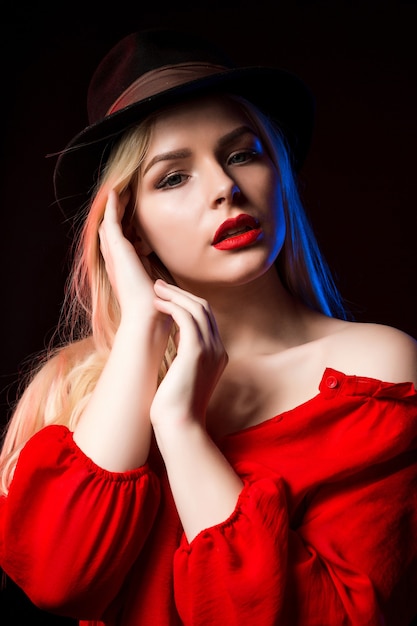 Premium Photo Romantic Blonde Woman Wearing Red Blouse And Hat Posing In The Shadow With Blue 