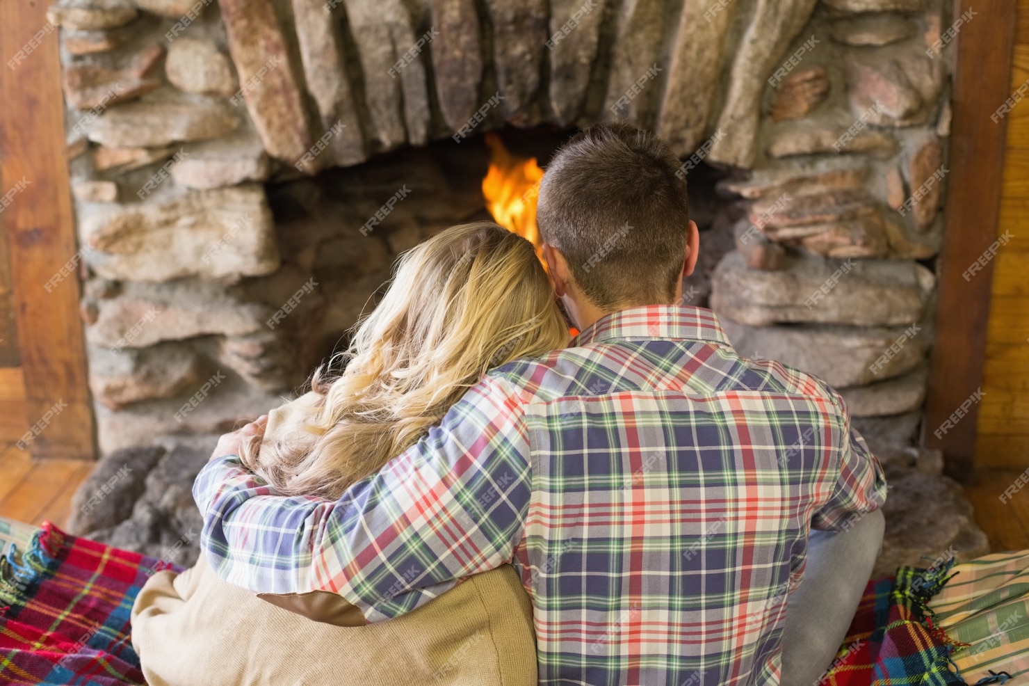 Premium Photo Romantic Couple Sitting In Front Of Lit Fireplace