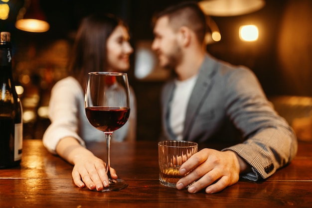 Premium Photo | Romantic evening in bar, love couple at wooden counter. lovers leisures in pub, husband and wife relaxing together in nightclub