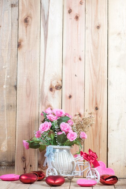 Premium Photo | Rose flower in vase pot, in the cafe table with wooden