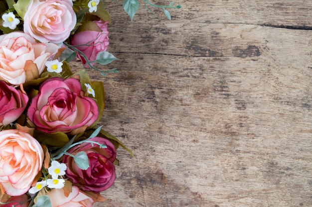 Download Rose flowers on rustic wooden background. Copy space ...