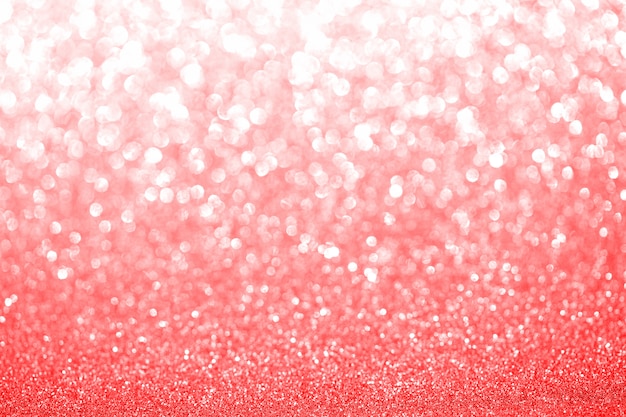 ローズピンクと赤ぼやけてキラキラ背景 クリスマスやバレンタインデーの休日にキラキラと光沢のある質感 季節の壁紙の装飾 プレミアム写真