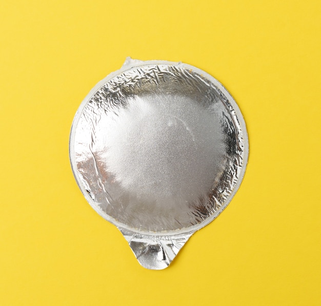 Download Premium Photo Round Aluminum Thin Lid For Plastic Yogurt Jars On A Yellow Background Top View