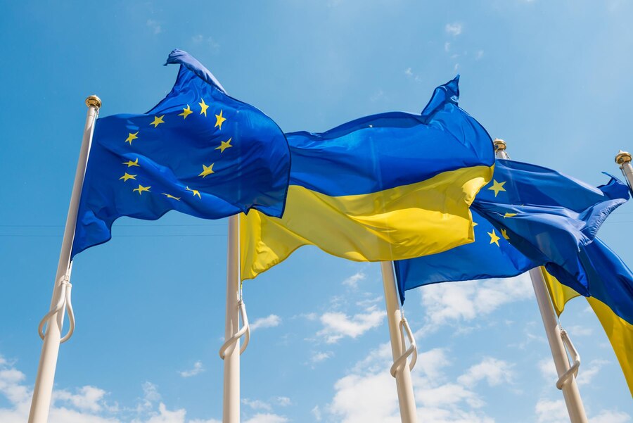 Premium Photo | Row of flag poles with european union and ukraine flags ...