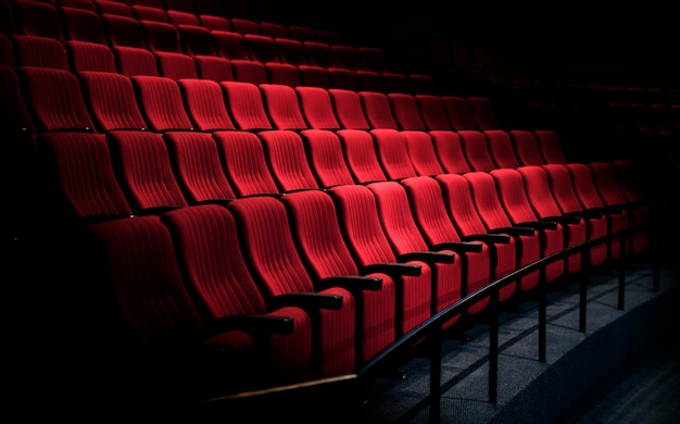 Rows of red seats in a theater Free Photo