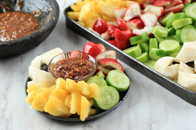 Premium Photo Rujak Buah Sliced Indonesian Fruit Salad Served With