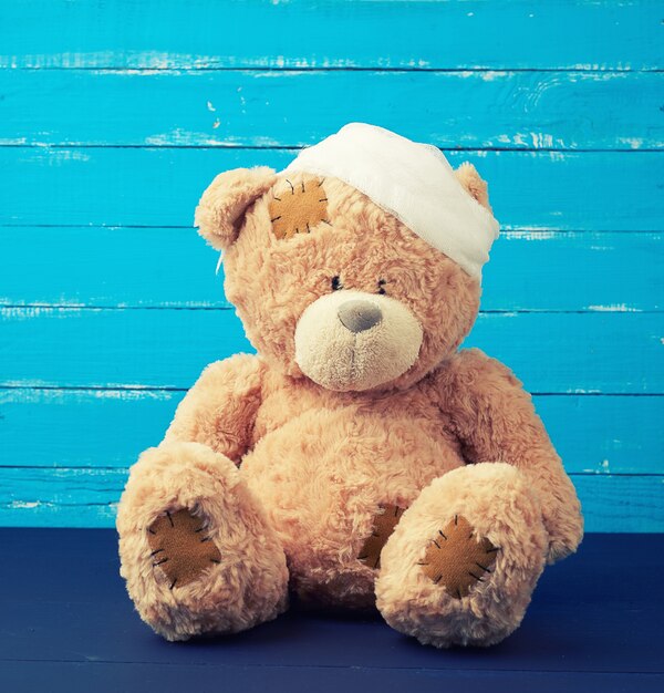 teddy bear with bandage on head