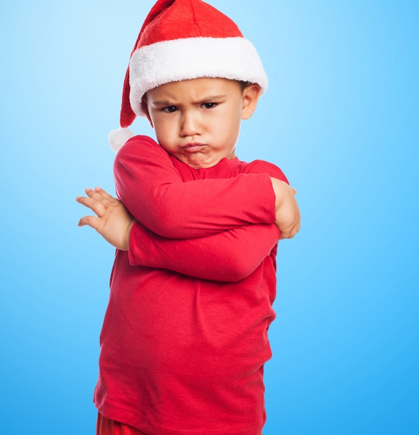 Sad little boy with crossed arms Photo | Free Download