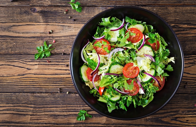 Free Photo Salad From Tomatoes Cucumber Red Onions And Lettuce Leaves Healthy Summer Vitamin Menu Vegan Vegetable Food Vegetarian Dinner Table Top View Flat Lay