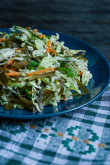 Premium Photo | Salad of white cabbage, sea kale and fresh carrots ...