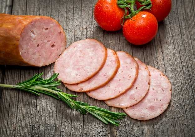 Premium Photo | Salami sausages sliced with pepper, garlic and rosemary ...