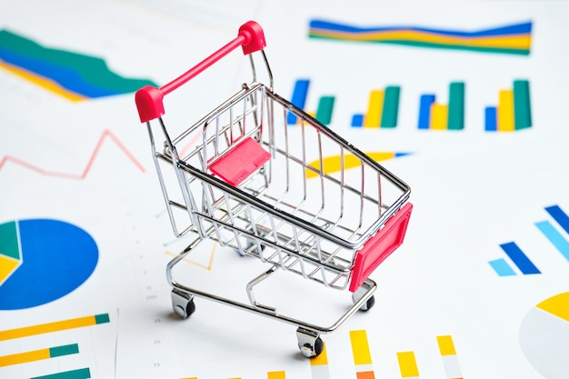 Premium Photo | Sales and demand graphs concept with store cart