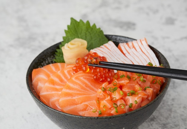 Premium Photo | Salmon donburi japanese rice bowl food with raw salmon ...