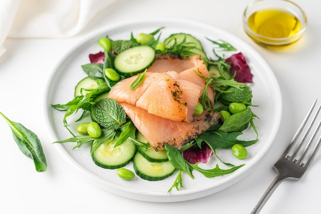 Salmon salad with cucumber spinach mizuna salad radicchio healthy food diet Premium Photo