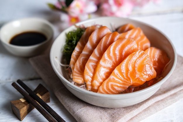 Premium Photo | Salmon sashimi with soy sauce, raw fish in traditional
