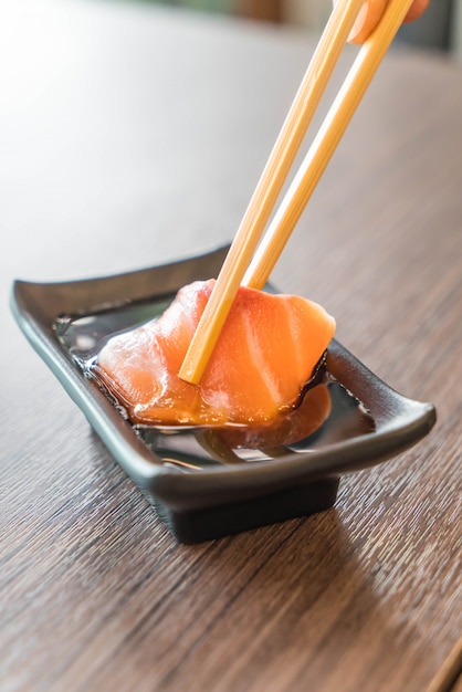 Premium Photo | Salmon Sashimi With Soy Sauce