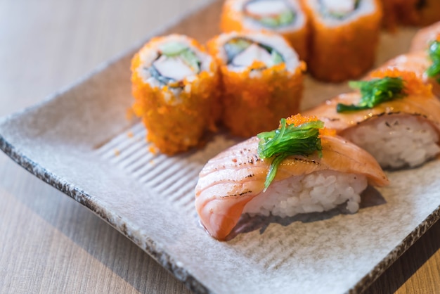 Free Photo | Salmon sushi and salmon maki