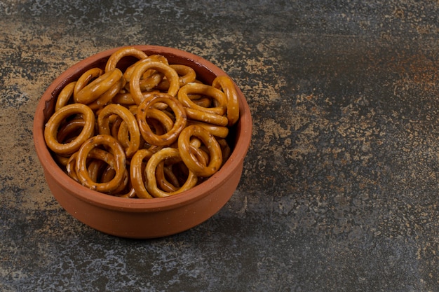 Free Photo | Salted circle pretzels in ceramic bowl.