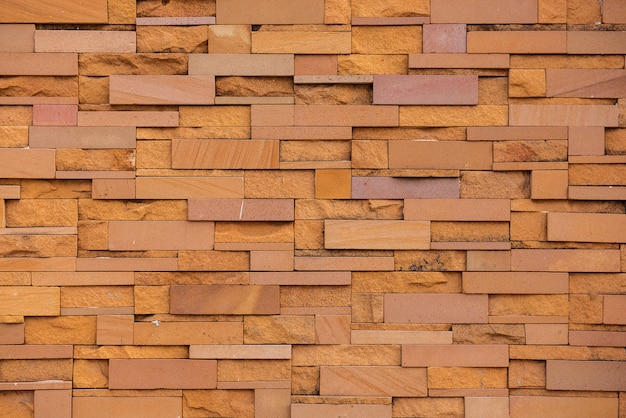 壁のシームレスな砂岩レンガ テクスチャと背景のパターン連続レプリケーション プレミアム写真