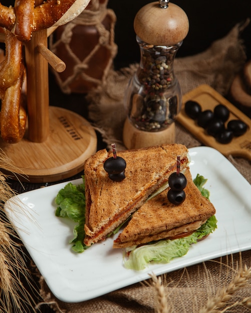 Free Photo | Sandwich topped with olives