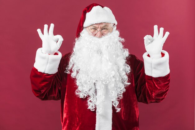 free-photo-santa-claus-in-glasses-showing-okay-gestures