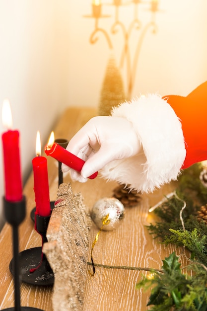 Free Photo Santa Claus Lighting Up Christmas Candles