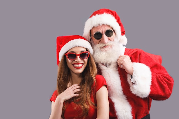 Premium Photo | Santa claus and young mrs. claus