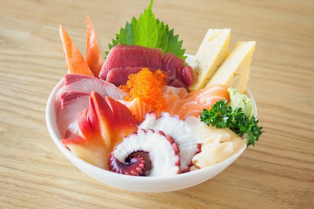 Premium Photo | Sashimi rice bowl chirashi don japanese food on wood ...