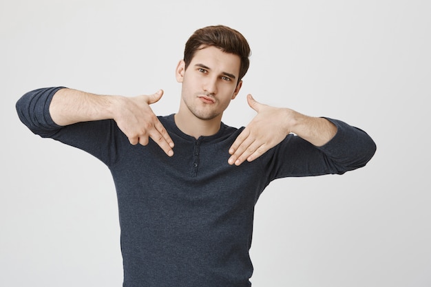 Free Photo Sassy Good Looking Guy Showing Gun Sign Acting Cool