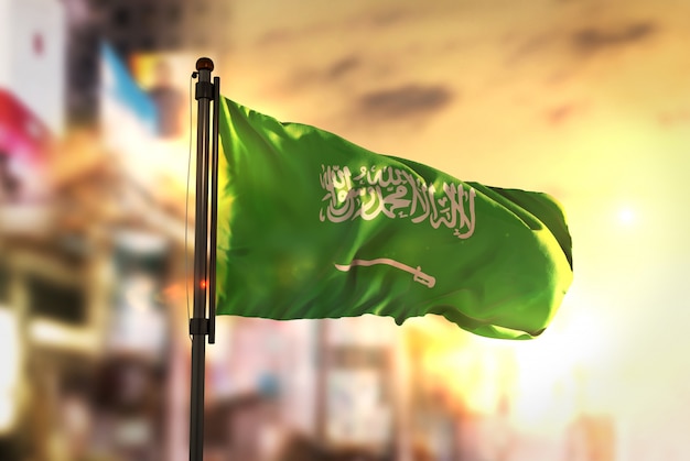 Premium Photo | Saudi arabia flag against city blurred background at